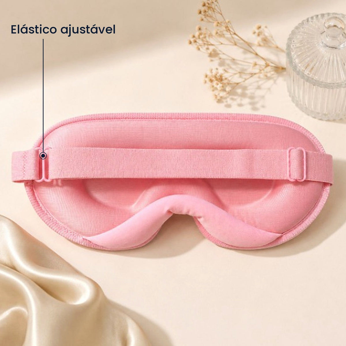 Máscara de dormir rosa com indicação do elástico ajustável